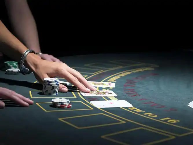 Filipino sports bettor placing wager on basketball game via smartphone